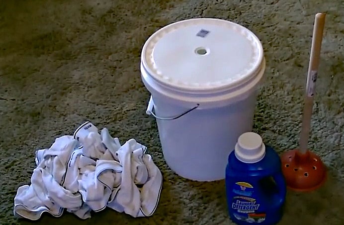 Make a camp washing machine using bucket and plunger