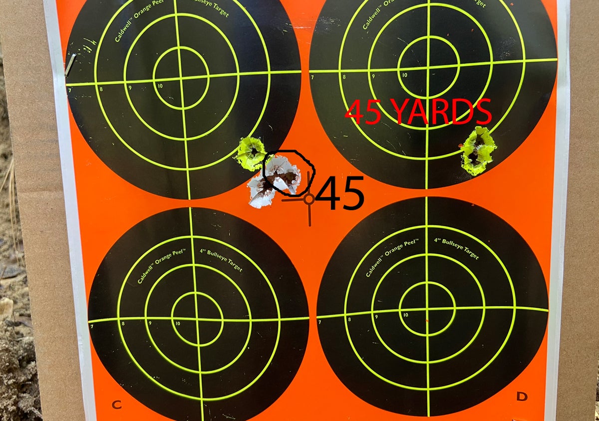 I aimed at the center of the target; fired the right group & adjusted, then fired the circled 45-yard group. Moved to 100 yards to fire the other two shots. (Photo © Russ Chastain)